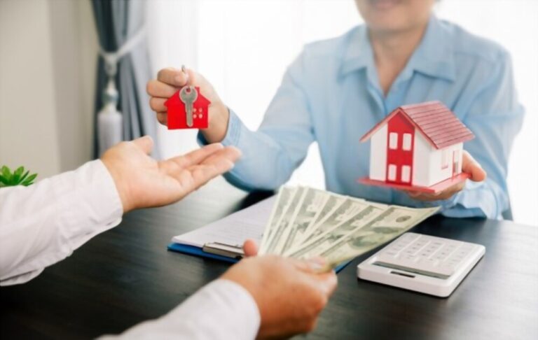 person paying for real estate with money